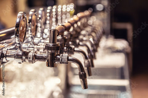Broad variety of draft beer pipes in a pub ready for serving beer