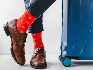 Men's legs, trendy shoes and bright socks. Close-up. Style, beauty and elegance concept