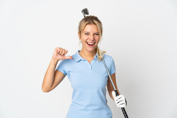 Young Russian woman isolated on white background playing golf and proud of himself