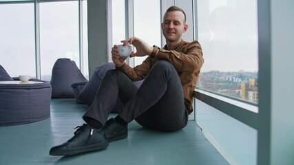 Sticker - Young businessman drinking coffee