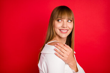 Poster - Profile side photo of young woman happy positive smile look empty space hand touch shoulder isolated over red color background