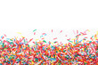 © New Africa - Colorful sprinkles on white background, top view. Confectionery decor