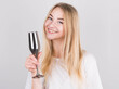 © Studio Nova - Portrait of beautiful young woman with long blond hair wearing white tank top posing with glass of champagne, isolated on white background