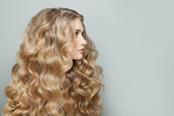 Wall Mural - healthy woman with long blonde hair on white, beautiful profile