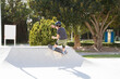 © Jose Prieto - Teenage boy in skateboard park against blue sky