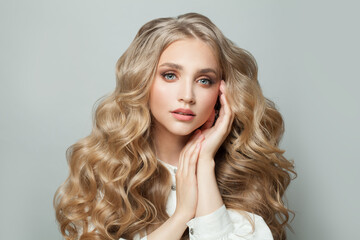 Wall Mural - pretty face. cute blonde woman with long healthy hair on white background