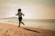 © Garun Studios - Happy kid having fun in summer vacation on the beach.Travel and vacation concept.
