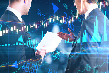 Wall Mural - Stock market analytics and analysis concept with two traders reading report and digital screen with growing financial chart graphs