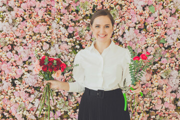 Happy pretty woman florist at work