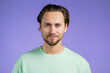 © kohanova1991 - Portrait of cheerful european man looking to camera.Young handsome kind guy smiling in studio on violet background.