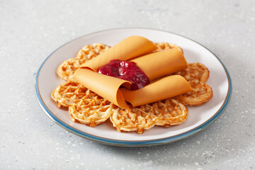 Sticker - waffles with Norwegian brunost traditional brown cheese and raspberry jam