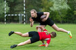 © Augustas Cetkauskas - Girls playing rugby together outside in summer. Woman sport concept