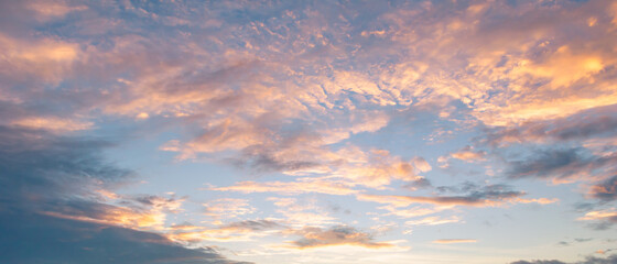 beautiful sky painted by the sun leaving bright golden shades.dense clouds in twilight sky in winter