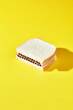 © Javier Díez/Stocksy - Bread sandwich with cigarettes on yellow background