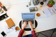 © BONNINSTUDIO/Stocksy - Unrecognizable woman using laptop for freelance job