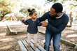 © Kristen Curette Photography LLC/Stocksy - Portrait of a little girl holding her dad's hand as she walks at the park