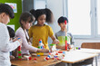 © JR-50 - Diversity of school students playing wooden blocks in classroom