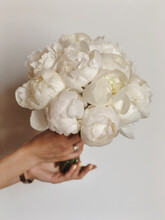 Woman Holding White Peony Bouquet