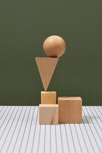 Wooden Geometric Shapes In Balance On Table