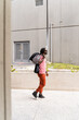 © Mauro Grigollo Photographer/Stocksy - A Black man goes to the office by walking