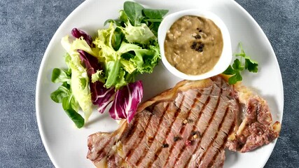 Sticker - fried beef steak with sauce and lettuce