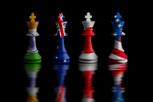 Quad Plus Countries Image Of A Chess King With Indian,australian,Japanese And American Flag Defeating White Chess Pieces. On Black Background.