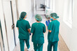 © Nunez Image/Stocksy - Backview of Medical Workers