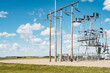 © unite images/Stocksy - electricity pylons on wheat field in sunny day