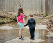 © Jakob Lagerstedt/Stocksy - Brother and sister holding hands on a hike