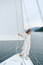 Beautiful Girl Travel Yacht In A White Dress.