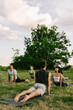 © VISUALSPECTRUM/Stocksy - Yoga Class in Green City Park