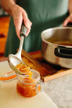 Pouring Finished Marmalade Into A Jar
