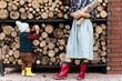 © Alina Hvostikova/Stocksy - Boy helping mother to pick firewood