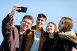 © Jovana Milanko/Stocksy - Teenage friends taking selfie