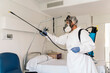 © Nunez Image/Stocksy - Worker Disinfecting Hospital