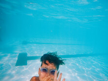 Boy Underwater In Pool.