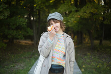 A Girl Holding An Apple