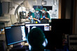 © Nunez Image/Stocksy - Back View of Faceless Doctor Using Computer