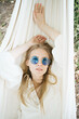 © Vradiy Art/Stocksy - Happy woman resting in hammock