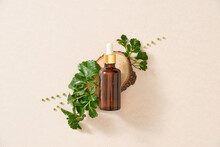 Flatley .essential Oil. Aromatic Oil. Essential Oil With A Flower And Fresh Medicinal Herbs On A White Background