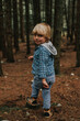 © Anna Malgina/Stocksy - A beautiful blond toddler in a forest