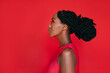 © AD Photography/Stocksy - Beautiful Black Woman on Red Background