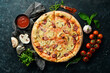 © Yaruniv-Studio - Homemade Pizza with sausages, mushrooms and cheese. On a black stone background. Free space for text.