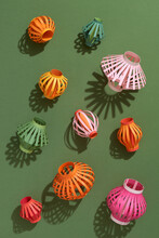 Group Of Many Size Lanterns From Colorful Paper On Green Background