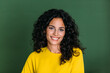 © MyMicrostock/Stocksy - Portrait of a brunette woman with curly hair looking at camera