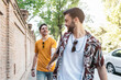 © Nunez Image/Stocksy - Happy Gay Couple Having Fun Outside