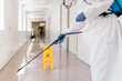 © Nunez Image/Stocksy - Worker Disinfecting Hospital