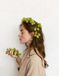© Yelizaveta Vlasenko/Stocksy - Woman with grapes