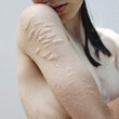 © Vradiy Art/Stocksy - Vulnerable sensual woman standing under water