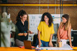 © MyMicrostock/Stocksy - Businesswomen looking at blueprints in an office